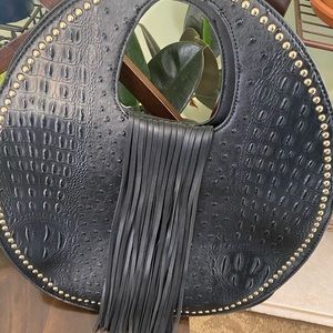 Black purse with black fringe satchel